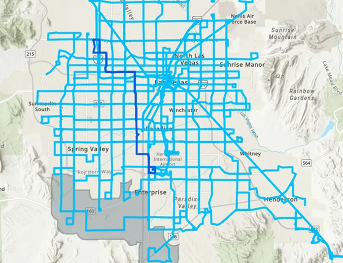 A map of the Las Vegas area with a network of bright blue lines showing various routes or pathways overlayed across streets and neighborhoods. Surrounding areas and landmarks are also labeled.
