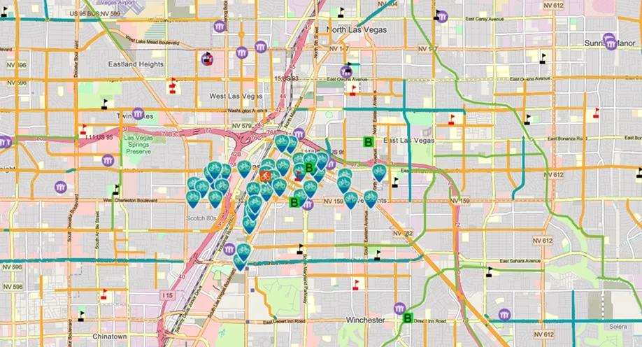 A detailed map of central Las Vegas highlighting multiple locations with blue pins, labeled ‘B’ markers, and various colorful icons on major roads and intersections. Neighborhoods and street names are also visible.